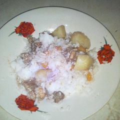 A picture of Rice,potatoes and meat.