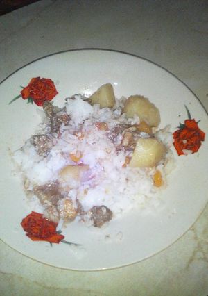 A picture of Rice,potatoes and meat.