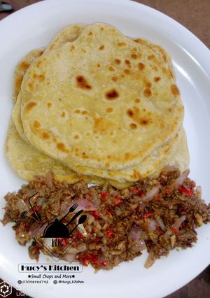 A picture of Paratha with onion and fish sauce.