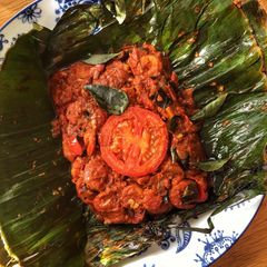 A picture of Prawn Pollichathu (Prawn cooked in Plantain leaf).