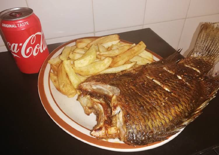 Grilled Bream fish and fried potato chips