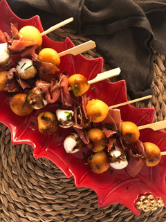 A picture of Ham, Mozzarella, and Melon Skewers.