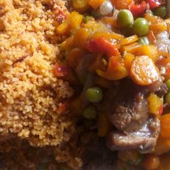 Jollof cous cous and carrot sauce A picture of Jollof cous cous and carrot sauce.
