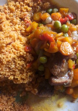 A picture of Jollof cous cous and carrot sauce.