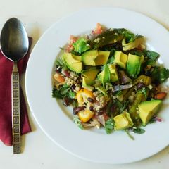 A picture of Quinoa with black beans and avocado- topped with Avocado cashew dressing.