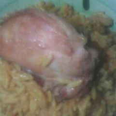 A picture of Jollof and chicken.