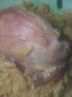 A picture of Jollof and chicken.