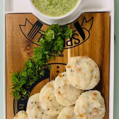 A picture of Rava Idli with Coriander Curd Chutney.