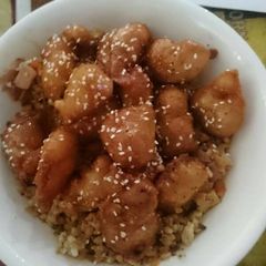 A picture of Honey chicken with fried rice.