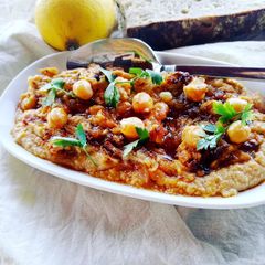 A picture of Humous with caramelised onions.