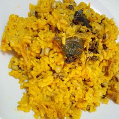 A picture of Palm oil rice and beans.