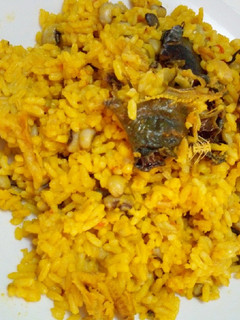 A picture of Palm oil rice and beans.