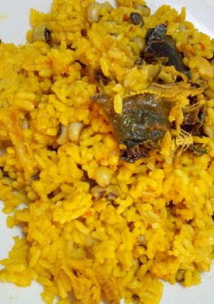 A picture of Palm oil rice and beans.