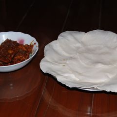A picture of Pathiri - Rice Bread.
