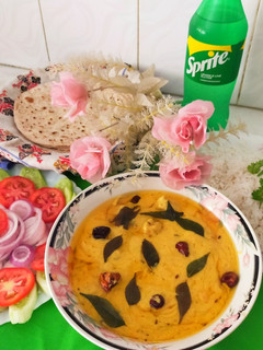 A picture of Pakoray wali dahi Curry/gramflour fritters with yogurt curry.