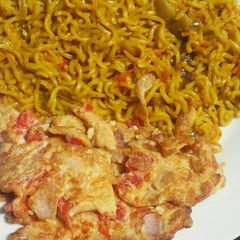 A picture of Turmeric noodles and fried egg.