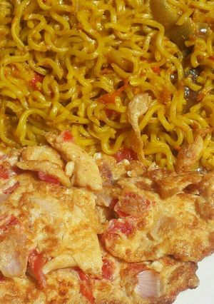 A picture of Turmeric noodles and fried egg.