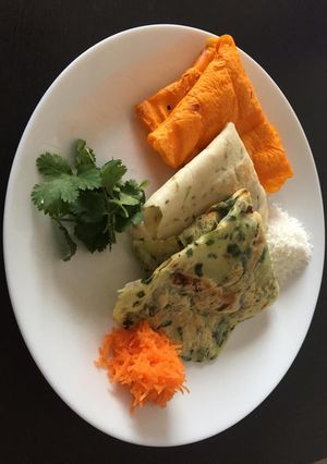 A picture of Tri colour talipettu / akki rotti.