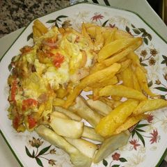 A picture of Fried potatoes and eggs.