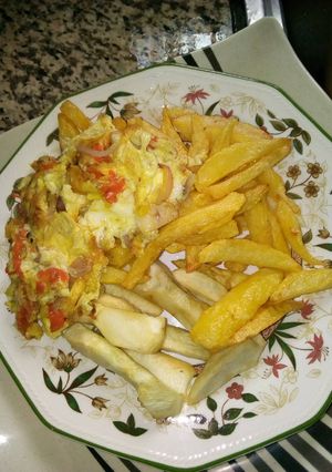 A picture of Fried potatoes and eggs.