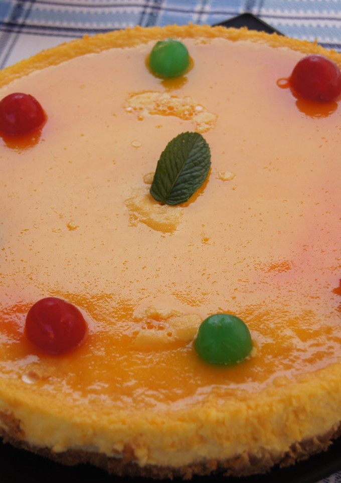 Una foto de Tarta de queso y naranja
