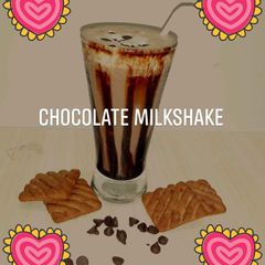 A picture of Chocolate milkshake with leftover cake and biscuits.