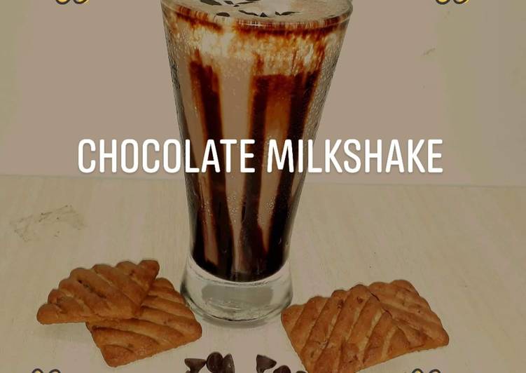 Chocolate milkshake with leftover cake and biscuits