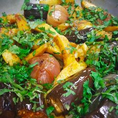 A picture of Potato brinjal and onion stuff.