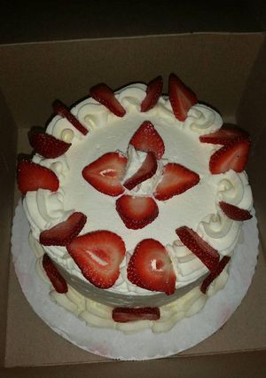 A picture of Strawberry Short Cake with real cream.