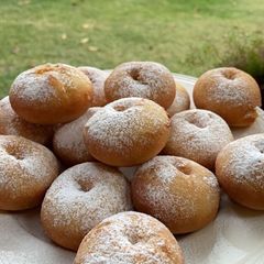 A picture of American style butter donuts with icing sugar !.