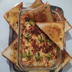 A picture of Veg Au gratin and Garlic herb toast.