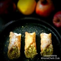 A picture of Cannoli stuffed with fresh fruit Srikhand.