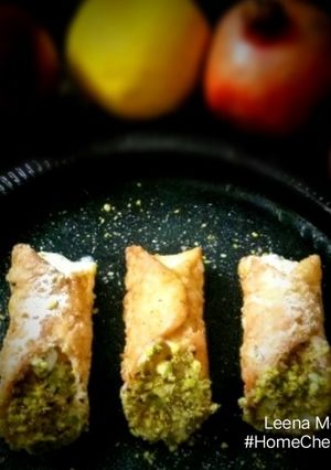 A picture of Cannoli stuffed with fresh fruit Srikhand.