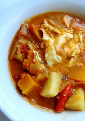 A picture of Potatoes and Poached Eggs in a Coconut Curry.