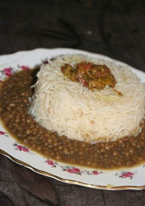 A picture of Masar dal with tarka rice & mix acahr.