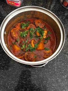 A picture of Egg Curry with Potato and Mushroom.