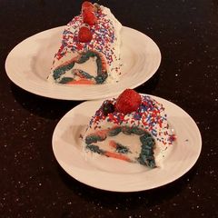Patriotic Vanilla Cake Roll with Whipped White Chocolate Ganache Filling and Frosting A picture of Patriotic Vanilla Cake Roll with Whipped White Chocolate Ganache Filling and Frosting.