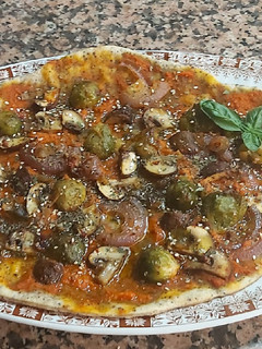 Una foto de Pizza verduras vegana