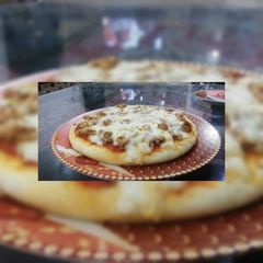 Chicken tikka pizza A picture of Chicken tikka pizza.