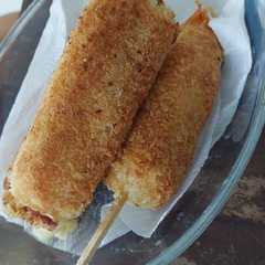 A picture of Cheese potato hot dog/corn dog ala Delicious Day.