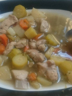 A picture of Vegetables and chicken soup.