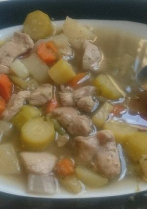 A picture of Vegetables and chicken soup.