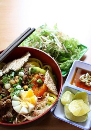 A picture of Quang-Style Beef Noodles (Mỳ Quảng Bò).