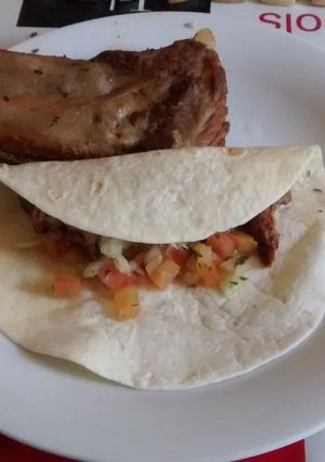 A picture of Carnitas Tacos with Pico de Gallo Salsa.
