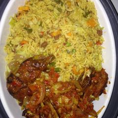 A picture of Fried rice and peppered chicken.
