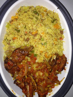 A picture of Fried rice and peppered chicken.