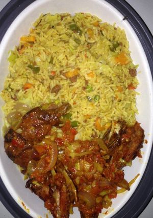 A picture of Fried rice and peppered chicken.