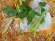 A picture of hot sauce and scallions