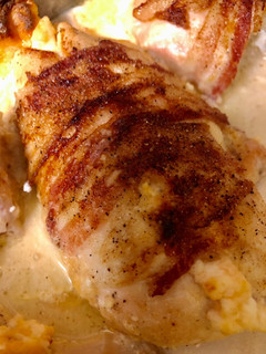 A picture of Bacon Wrapped Cream Cheese Stuffed Chicken.
