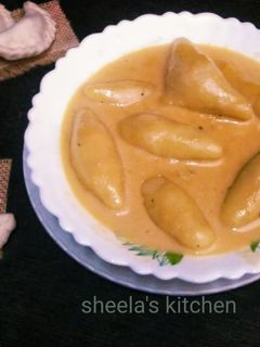 দুধ পুলি পিঠে (doodh puli pithe recipe in Bengali) রেসিপির প্রধান ছবি